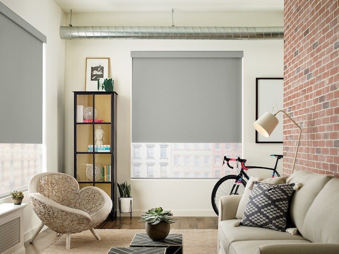 A living room with couch and side chair.